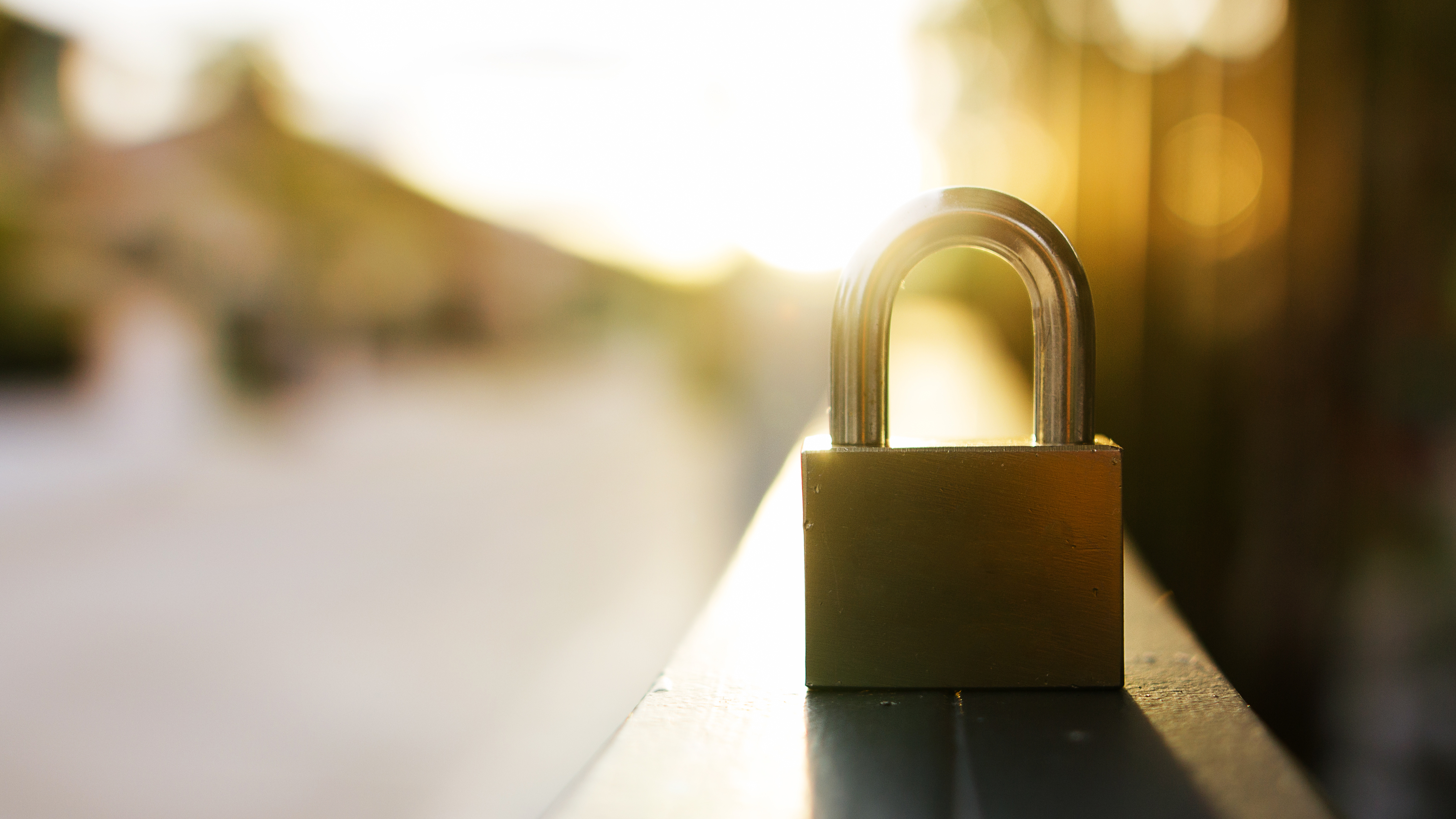 padlock sitting on railing