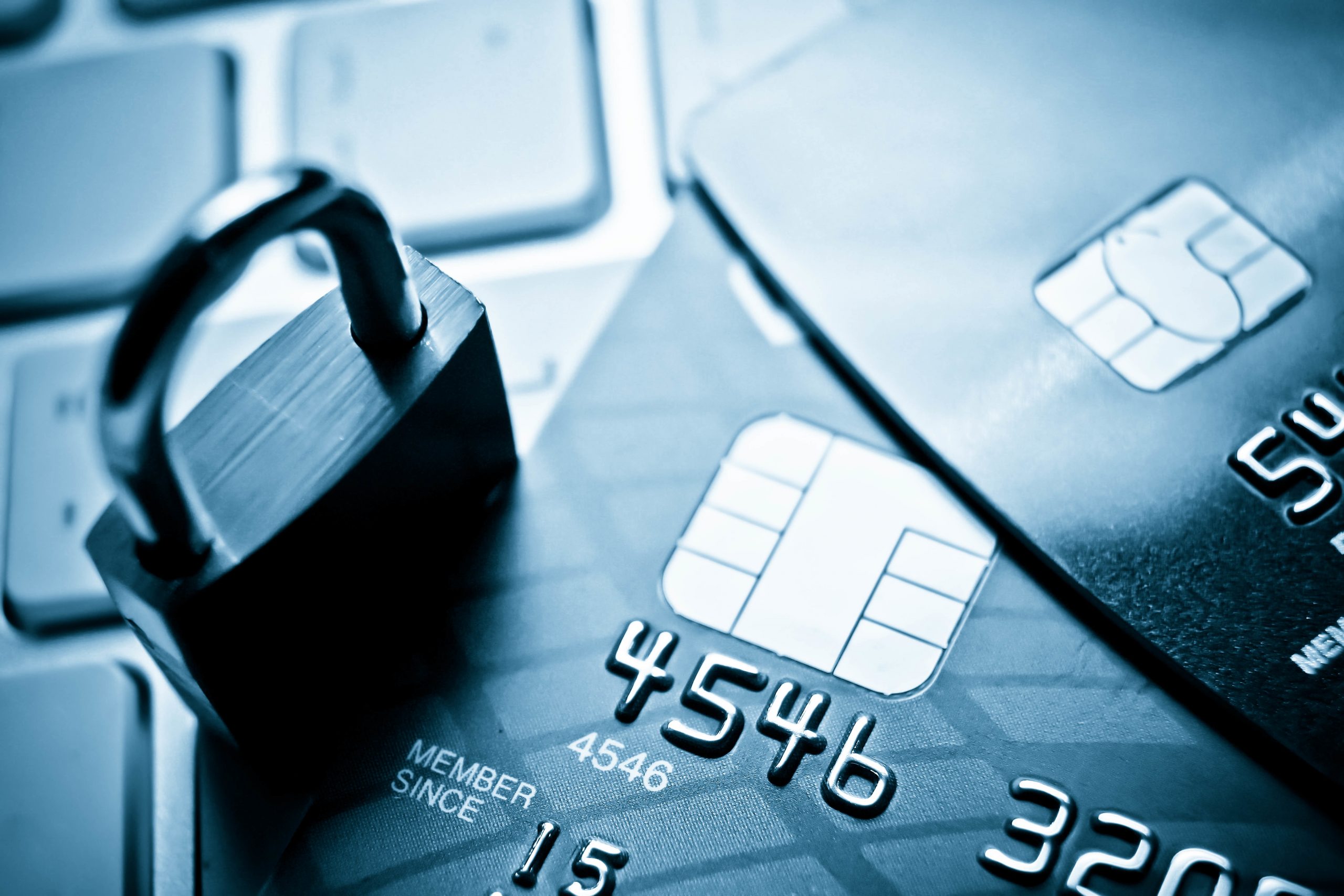 security lock and credit cards on keyboard